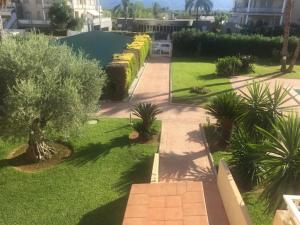 A garden outside MET&GOLF OLIVA NOVA BEACH JARDIN