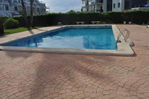 The swimming pool at or close to MET&GOLF OLIVA NOVA BEACH JARDIN
