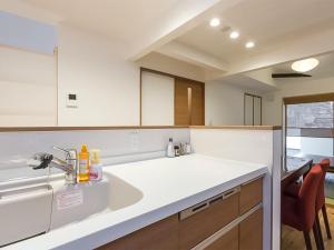 a kitchen with a sink and a counter top at Aya inn Karasuma gojo in Kyoto +91 photos