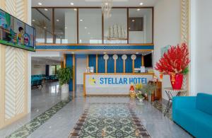 a hotel lobby with a starrider hotel sign on the wall at Stellar Hotel in Phu Quoc