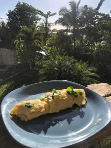 a piece of food on a blue plate at Sol y Sombra in Bocas Town