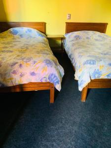 Tempat tidur dalam kamar di Hospedaje