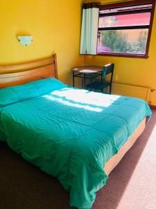 Кровать или кровати в номере Hospedaje