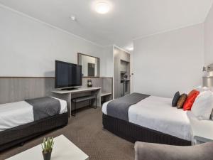Postel nebo postele na pokoji v ubytování Comfort Inn Glenelg