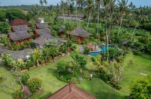 an aerial view of a resort with a pool at Pangkung Carik Villa by Pramana Villas in Blahbatu
