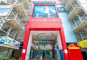 a vishalarma mall with a sign on the front of it at Aishwaryam Hotel in Tallākulam