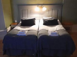 Postel nebo postele na pokoji v ubytování Bergsgården Hotell & Konferens