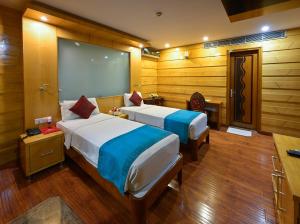 Cama o camas de una habitación en Hotel Emarald, New Delhi