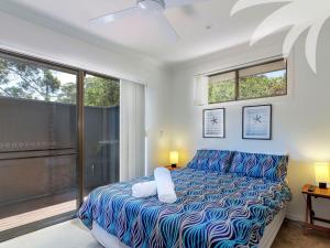 A bed or beds in a room at Aqua Apartment #1