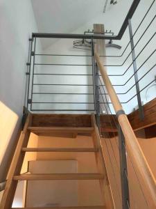 a set of stairs in a room with a railing at 'T Achterhuys in Ostend