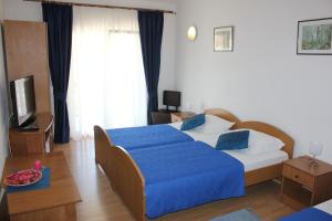 Posteľ alebo postele v izbe v ubytovaní Guesthouse San Antonio