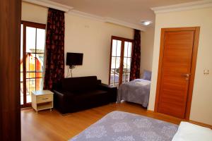 A bed or beds in a room at Miletus Otel Şile