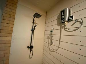 a shower in a bathroom with a shower at Elephant Arcade in Tissamaharama