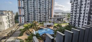 an aerial view of a pool in a resort at Pool view + water theme park @swiss garden residence in Kuantan