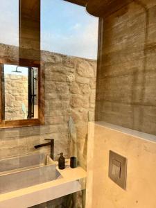 a bathroom with a sink and a mirror at Mikro1890 in Mesogi