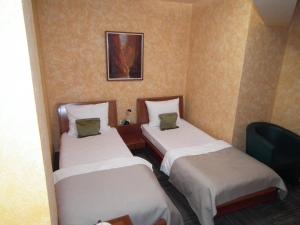Uma cama ou camas num quarto em Hotel Kerber