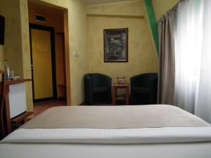 Uma cama ou camas num quarto em Hotel Kerber