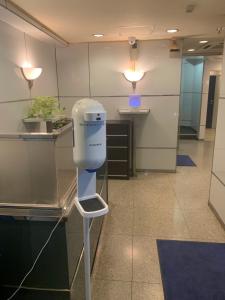 an office with a dryer on a stool in a room at City Hotel Dolphin in Tokyo