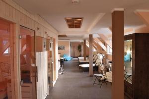 a hallway with a living room with a couch at Hotel Thüringenschanze in Oberhof