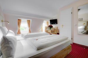 Postel nebo postele na pokoji v ubytování Hotel Fürst Bismarck