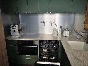 Kuchyň nebo kuchyňský kout v ubytování MyHome - Très Beau T3 refait à neuf - Tichot Val Claret