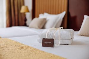 Postel nebo postele na pokoji v ubytování Garni Hotel Planeta Inn