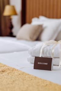 Postel nebo postele na pokoji v ubytování Garni Hotel Planeta Inn