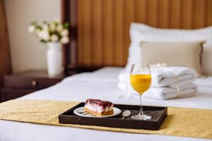 Postel nebo postele na pokoji v ubytování Garni Hotel Planeta Inn