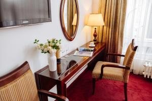TV a/nebo společenská místnost v ubytování Garni Hotel Planeta Inn + 35 fotografií