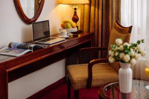 TV a/nebo společenská místnost v ubytování Garni Hotel Planeta Inn
