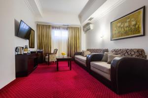 TV a/nebo společenská místnost v ubytování Garni Hotel Planeta Inn