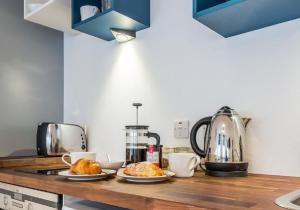 a kitchen with two plates of croissants on a counter at Number 70 in Haddington