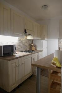 Kuchyň nebo kuchyňský kout v ubytování Appartamento in Residence Signorile