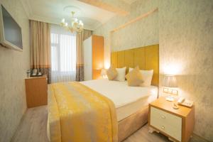 Postel nebo postele na pokoji v ubytování Miran Hotel