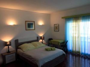 Ένα ή περισσότερα κρεβάτια σε δωμάτιο στο Lagos Room Booking