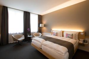 Giường trong phòng chung tại Best Western Plus Hotel Zürcherhof