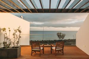 a dining room with a view of the ocean at Ocean View by Azores Villas in Ponta Delgada +14 photos