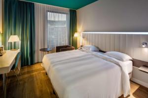 Krevet ili kreveti u jedinici u okviru objekta Park Inn by Radisson Stuttgart