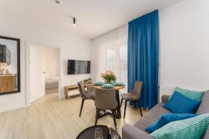 TV a/nebo společenská místnost v ubytování Sunset Resort - Apartament Florencja