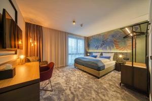 Giường trong phòng chung tại NYCE Hotel Bonn