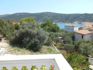 a view of a town with trees and a body of water at Apartments Zdenka in Marina +11 photos