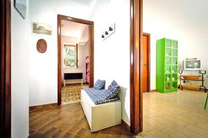 a living room with a couch and a mirror at Holiday flat, Castellammare del Golfo in Castellammare del Golfo