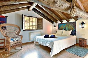 Un pat sau paturi într-o cameră la La Casa del Agua