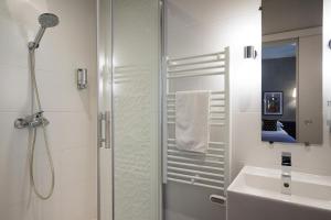 a bathroom with a shower and a sink at Hotel Voltaire Opera Nantes Centre in Nantes +37 photos