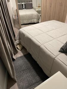Een bed of bedden in een kamer bij AL PRAÇA