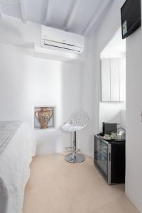 Posteľ alebo postele v izbe v ubytovaní aníko suites Chora