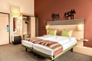 Letto o letti in una camera di TUI BLUE Schladming