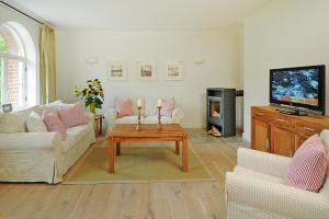 a living room with a couch and a coffee table at Apartment in Garz with parking space in Garz-Rügen