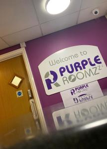 a sign that reads welcome to purple room at Purple Roomz Preston South in Preston