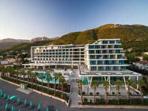 an aerial view of a resort with palm trees at Carine Hotel Kumbor Superior in Herceg-Novi